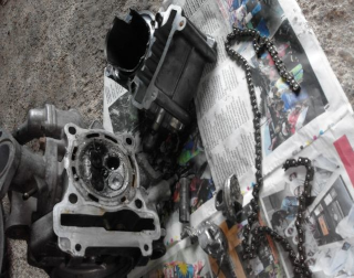 A disassembled motorcycle engine on newspaper illustrates timing pitches around a journalist's deadlines for media relations.