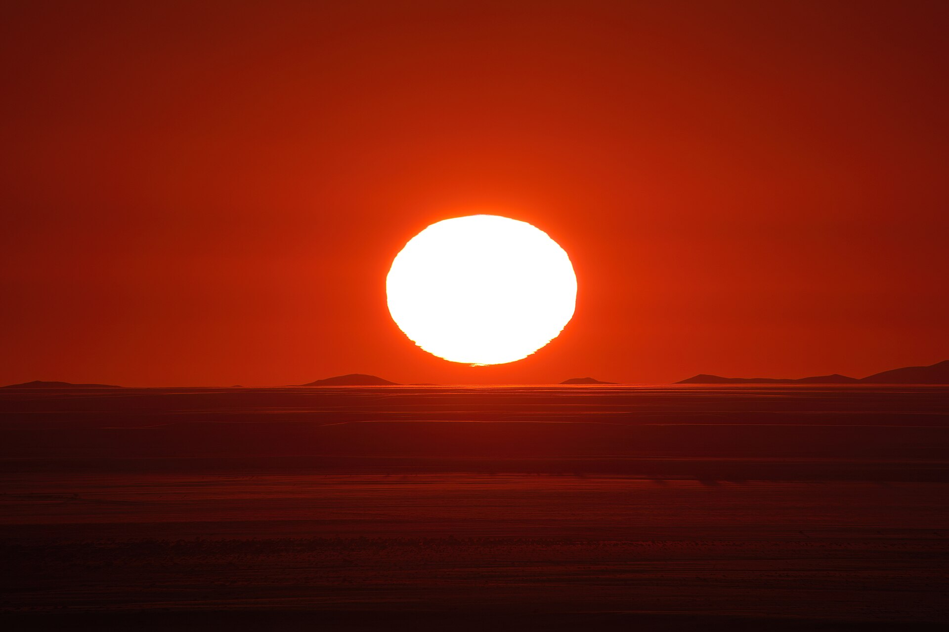 A serene sunset over the ocean represents setting a single campaign objective for effective media relations.