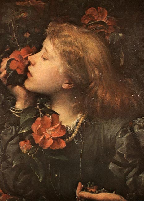 A young person with red hair gently smells a vibrant red camellia flower, illustrating earned media.